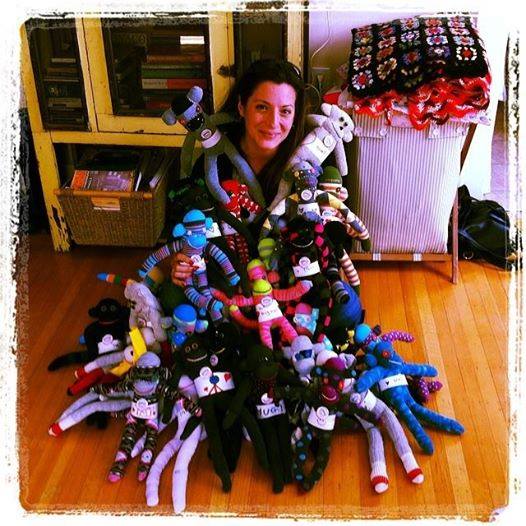 Loretta Cella, Passion Foundation, with sock monkeys headed to South Africa as part of Loretta's work at Patch Centre.